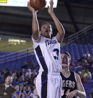 Federal Way sophomore Talia Walton goes up for a shot during Wednesday's 61-44 win over Lewis & Clark at the Class 4A State Girls Basketball Tournament at the Tacoma Dome. Lewis & Clark won a state-record three state titles in a row from 2006-08. Walton finished with 10 points for the Eagles.