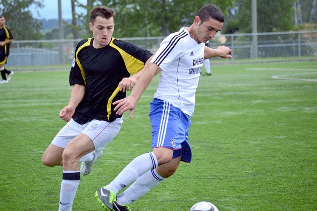 Competitors vie for control of the ball during a soccer game at the annual Desna Cup event in years past. The event hosts tournaments of soccer and volleyball and will include a bike ride this year.