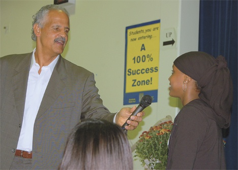 Stedman Graham asks TAF Academy ninth-grader Fartun Mohamed a question during his motivational speech to the school on Tuesday.