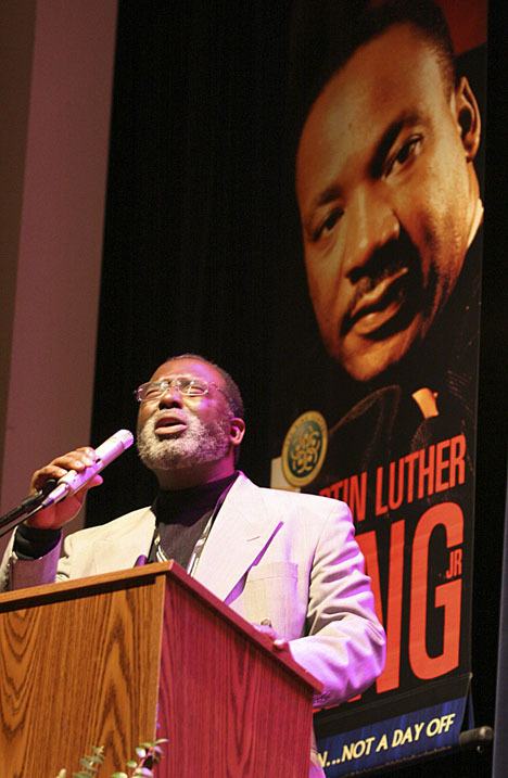 Ron Walker leads a rendition of 'We Shall Overcome' during last year's Martin Luther King Celebration at Decatur High School in Federal Way.