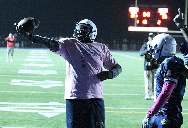 Decatur High School senior Dom Cooks celebrates after scoring a touchdown during a homecoming football game against Auburn Mountainview last October. Cooks was diagnosed with an inoperable brain tumor in April 2012.  Decatur will hold a special graduation ceremony for him on Feb. 20.