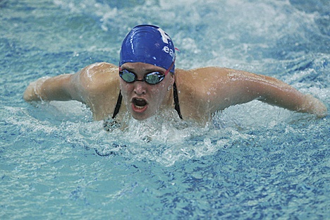 Federal Way High School swimmer Keely Craig competes in the butterfly portion of the 200-yard individual medley event during the Eagles’ dual meet against the Auburn Riverside Ravens Thursday at the Federal Way Community Center. Craig won the event in a tight race against an Auburn Riverside swimmer.