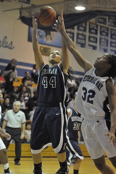 Auburn Riverside's Kat Cooper goes up for a rebound over Federal Way's Jaleecia Roland during Friday's 61-47 Auburn Riverside win in an early-season SPSL North Division showdown.