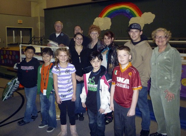 Students from Truman High School along with Mike and Carol Stanley recently delivered a light system to Green Gables Elementary in Federal Way.