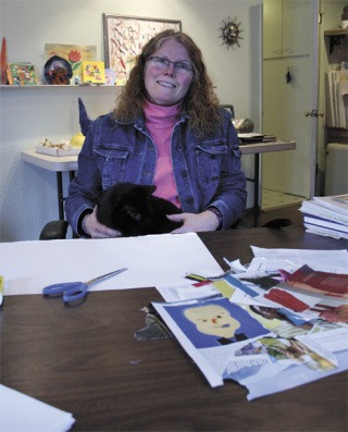 Mayda Taney sits with her cat
