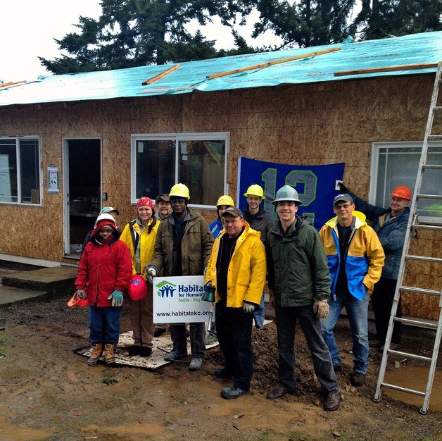 Habitat For Humanity volunteers work on one of the Westway houses funded by the Neighborhood Stabilization Program grant.