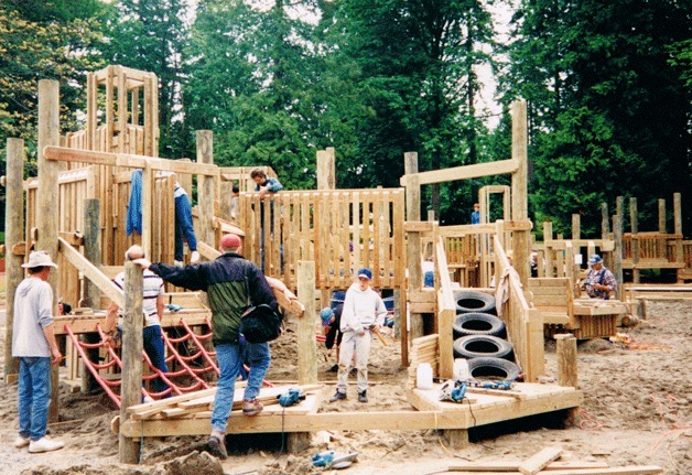 Community members help work on 'Family Funland' play structure at Steel Lake Park in 1994. The park is currently closed for major renovation