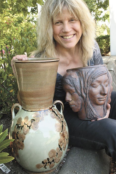 Auburn artist Leah Boehm shows a stoneware piece she crafted by using face molds from real people. Boehm will join about 30 artists for the FUSION summer arts festival Aug. 5 at Dumas Bay Centre.