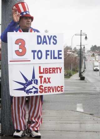 Balbir Purewal is a sign waver for Liberty Tax Service in Federal Way near South 320th Street and 23rd Avenue South. On April 13