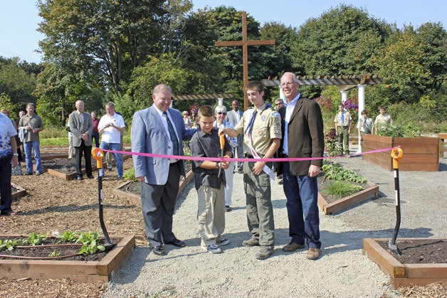 Ribbon cutting was done by Jason Parks (BSA Troop 336) with Mayor Skip Priest and Evan Ailinger with Pastor Ted Werfelmann from Light of Christ Church.