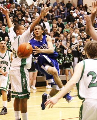 Federal Way High School senior point guard Michael Hale goes up for a lay-in during Tuesday's 61-53 Eagle win over Kentwood. Hale led the unbeaten Eagles with 23 points.