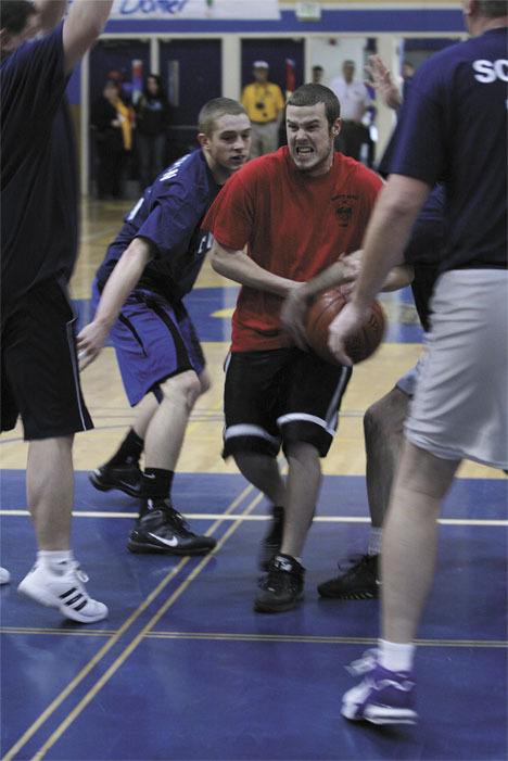 Ben Carlman of South King Fire and Rescue's team battles a gauntlet of defenders Saturday at Decatur.