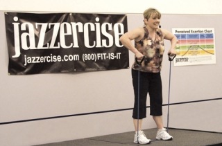 Kimberly DeMile teaches a strength-training routine during a Jazzercise dance fitness class in Federal Way.
