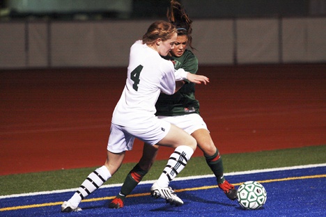 Beamer defender Jasmine Brilliante (right) battles with Kentwood midfielder Reilly Retz during Wednesday's South Puget Sound League Tournament at Federal Way Memorial Stadium. Kentwood won the game 3-1 to earn the SPSL's third seed into Saturday's West Central District Tournament. Beamer will be the fourth seed.