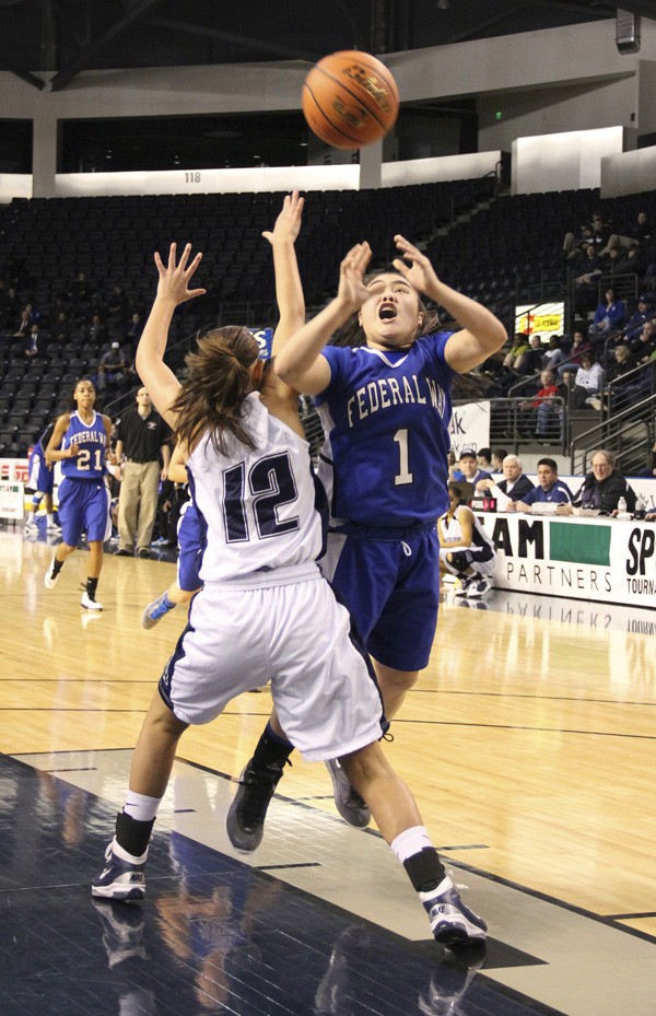 Federal Way junior guard Darah Huertas-Vining attempts a shot during the SPSL Championship game Friday night at the Showare Center in Kent. Auburn Riverside beat the top-ranked Eagles