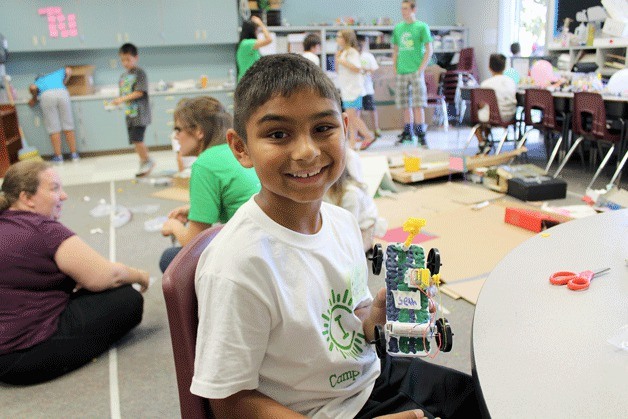 Seth Thomas holds up his battery-operated car he made at Camp Invention. Camp Invention was held at Green Gables Elmentary school from Aug. 4-8