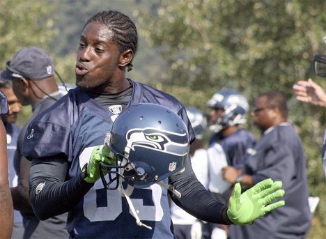 Seahawks wide receiver Deion Branch has fun on the sidelines during training camp practice Monday morning in Renton.