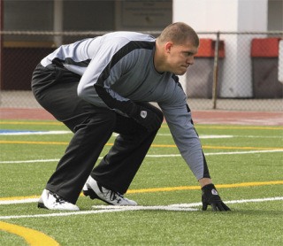 Central Washington tight end and Jefferson graduate Jared Bronson works out for Jacksonville Jaguars’ assistant Mike Tice last month at Federal Way Memorial Stadium in preparation for this weekend's NFL Draft in New York City.