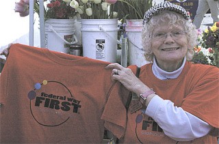 Joy March handed out Federal Way First T-shirts at the Farmers Market on Saturday