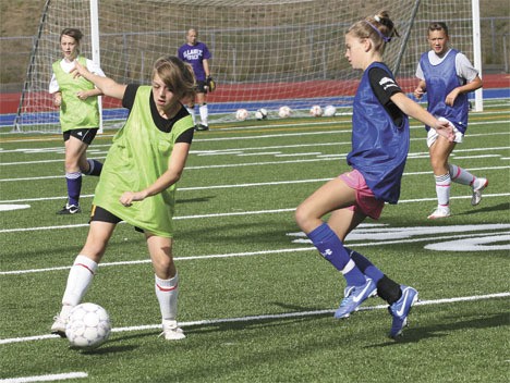 The Federal Way High School girls soccer team practices Thursday for the upcoming season.