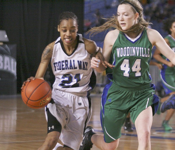 Federal Way senior Dyesha Belhumeur drives to the basket during the Eagles' loss to Woodinville at the 2012 State Girls Basketball Tournament Friday inside the Tacoma Dome.