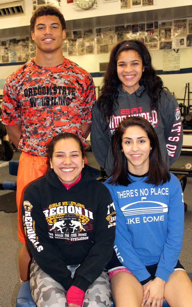 Federal Way High School wrestlers get ready for their state meet toward the end of February. Back left to right is Andrzej Hughes-Murray and Tally Thomas. Front left to right is Fernanda Carmona and Ana Sanchez.
