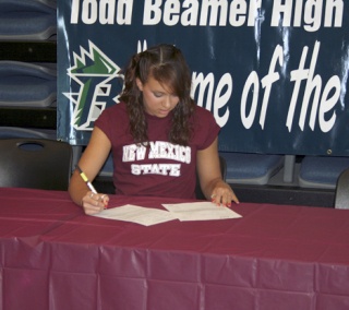 Beamer High School senior Eryn Murphy signs her national letter of intent to swim in the fall at New Mexico State University in Las Cruces Wednesday.