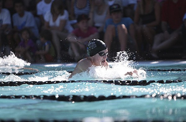 Marine Hills Swim Team member Robert Hughes swim the breaststroke during the All-City Championships Tuesday at the Sand Point Country Club in Seattle. Marine Hills won the team title for the third year in a row.