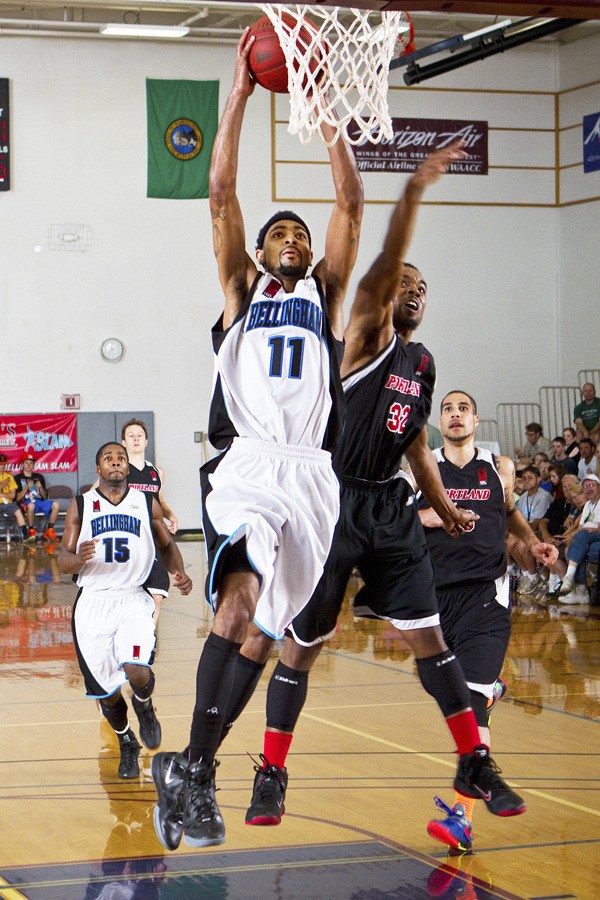 Morris Anderson goes up for a dunk during the second half of the 2012 International Basketball League championship game for the Bellingham Slam on July 8 at Whatcom Pavilion.