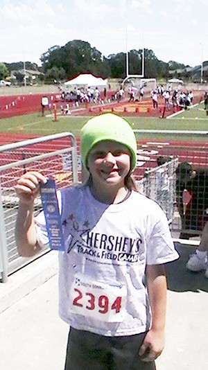 Nautilus Elementary 9-year-old Kayla Johnson will head to Pennsylvania next month for the Hershey National Track and Field Meet in the softball throw.