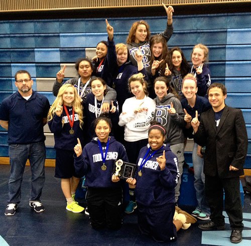 Todd Beamer wrestling girls team celebrate their victory together. The girls came in first place at the Rogers Holiday Tournament.