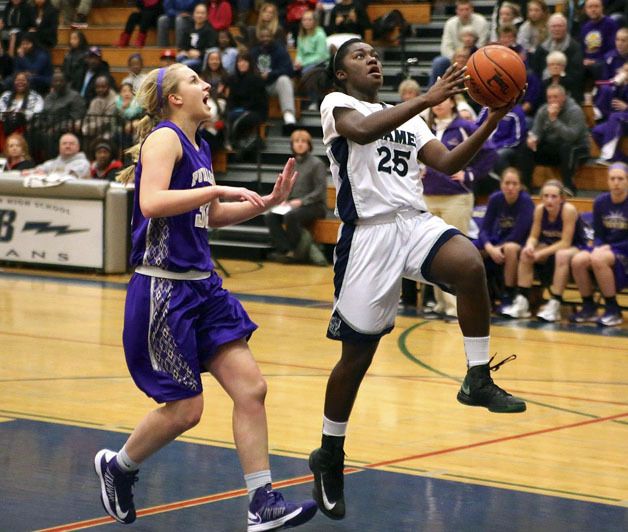 Todd Beamer freshman Nia Alexander goes up for a layin during the Titans' 61-49 win over the previously unbeaten Puyallup Vikings. Alexander scored a game-high 18 points.