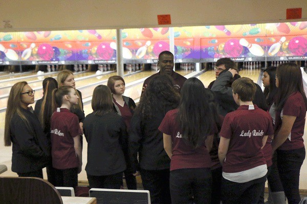 Thomas Jefferson head coach Joseph Townsend addresses the Thomas Jefferson girls bowling team after their 4-1 win over Decatur on Jan. 12.