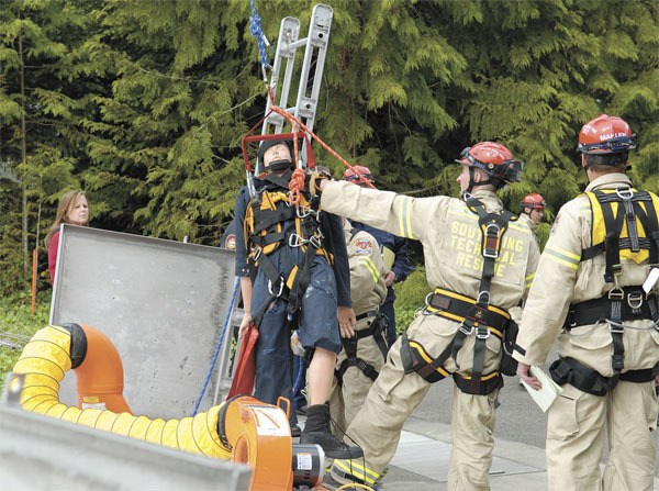 South King Fire and Rescue’s technical rescue team performs a drill last month at the wastewater plant on Dash Point Road.