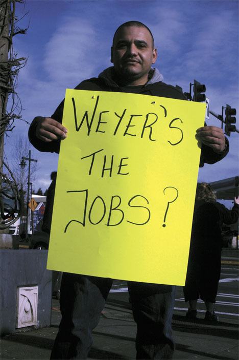 Federal Way resident Omar Rubi was among nearly 50 protesters to occupy the intersection of South 320th Street and Pacific Highway on Thursday morning. Working Washington co-organized the rally to protest Federal Way-based timber corporation Weyerhaeuser