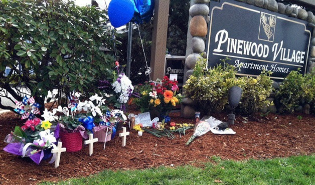 A memorial site at the Pinewood Village Apartments in April honors the four victims who were shot and killed in one of the deadliest incidents in Federal Way history. Police also fatally shot the man responsible for the shootings.