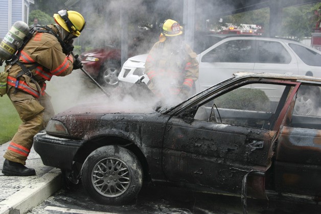 Federal Way resident Barry Turnbull snapped several photos of South King Fire and Rescue crews extinguishing a vehicle fire around 10 a.m. Monday at the Pinewood Apartments