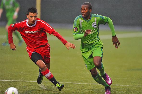 Decatur High School graduate Dom Dismuke (right) will start playing with the University of Washington this speing. Dismuke also played for the Sounders FC Under-18 Academy Team.