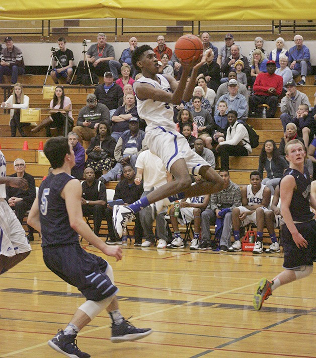 Federal Way Eagles' Jalen McDaniels drives into the post against Gig Harbor Saturday in the 4A district tournament.