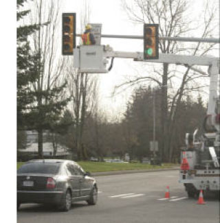 Workers from King County are installing signs at intersections around town to help drivers navigate the new flashing-yellow turn lights. Drivers can make a free left turn when the lights flash yellow.