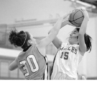 (Top) Jefferson junior Hannah Kiyohara led the Raiders in scoring last season with 11.1 point a game. She scored in double digits in 17 of TJ’s 25 games. (Below) Federal Way High School senior Jacqie Evenson averaged 11.4 points