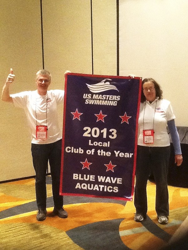 Blue Wave Aquatics was named the U.S. Masters Swimming 2013 Local Club of the Year. Hugh and Jan Moore hold the banner in this photo.