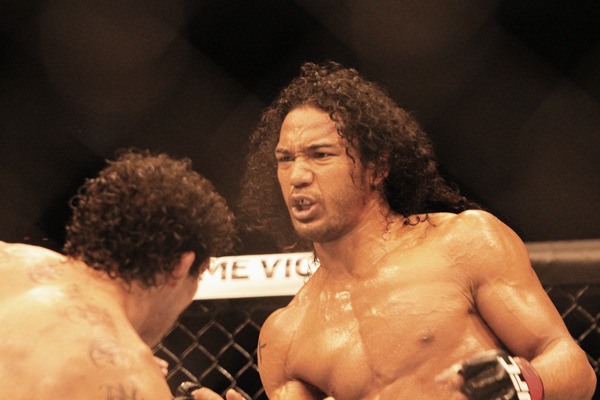 Decatur graduate Benson Henderson defended his UFC lightweight championship with a split decision win over Gilbert Melendez Saturday in San Jose. He then proposed to his girlfriend in the Octagon.