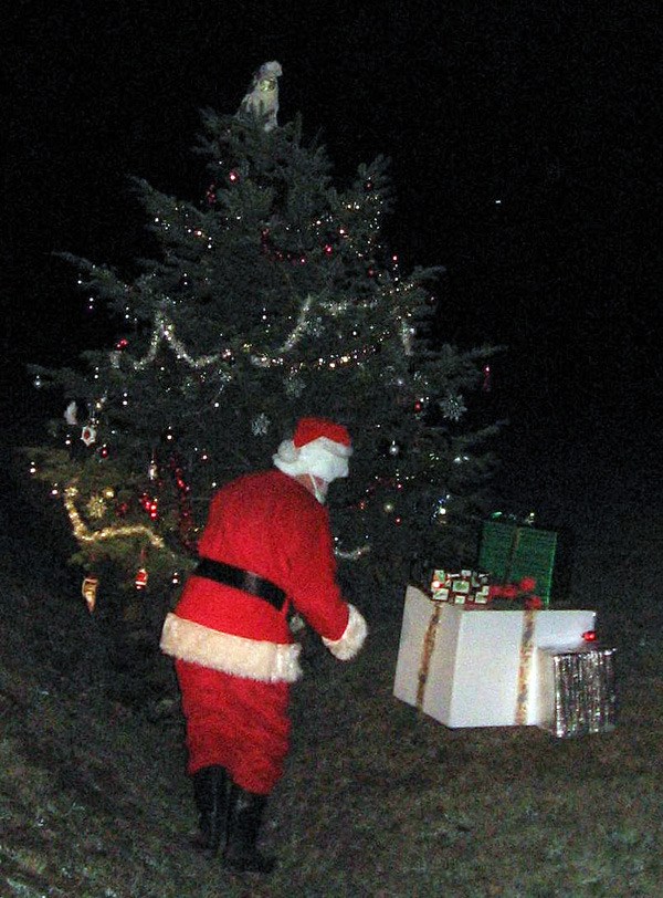 Tracey Galland of unincorporated King County sent this photo of Santa visiting the tree last Friday night.