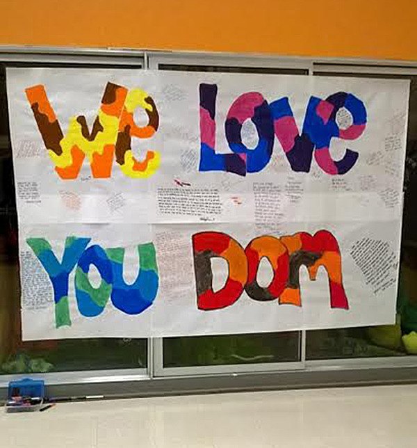 Posters have been set up around the campus of Decatur High School with messages for Dom Cooks. The Decatur senior passed away from brain cancer on Tuesday night.