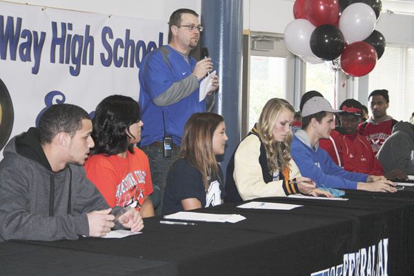 A school-record eight student-athletes signed National Letters of Intent at Federal Way High School Wednesday morning. From left to right