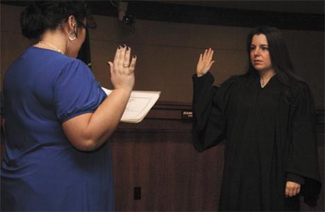 Rebecca Robertson is sworn in Dec. 31 as Federal Way's new judge by deputy city clerk Stephanie Courtney.