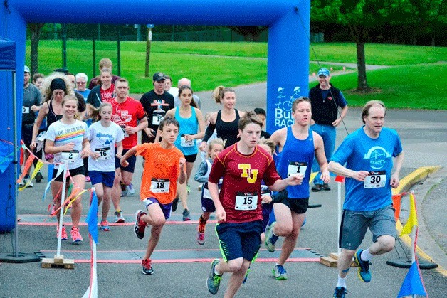 Runners take off from Celebration Park during the ET Classic 5k fun run on Saturday.