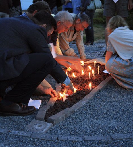 Church members place their candles in the center of the 'Labyrinth' on Aug. 21 at the Saltwater Unitarian Universalist Church in Des Moines. The ceremony was marked by songs and remembrances of Jason Puracal before his imprisonment.
