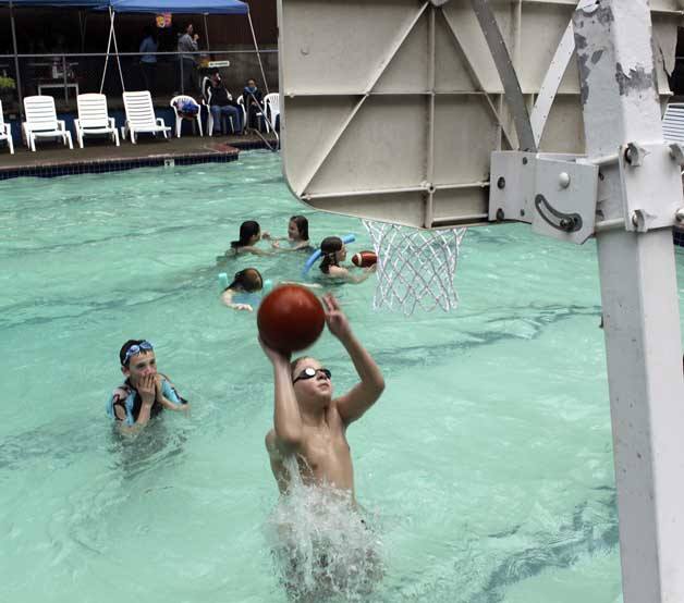 Children splash away May 7 at the Marine Hills Swim and Tennis Club in Federal Way.